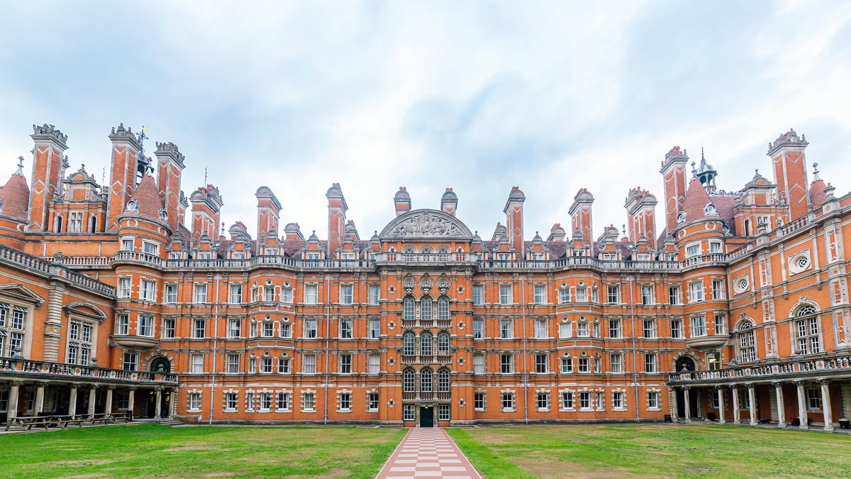 Historic red-brick British university building with Victorian architecture