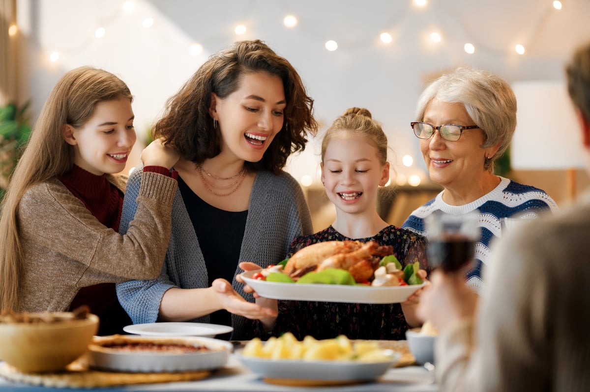A warm family gathered around a dining table together